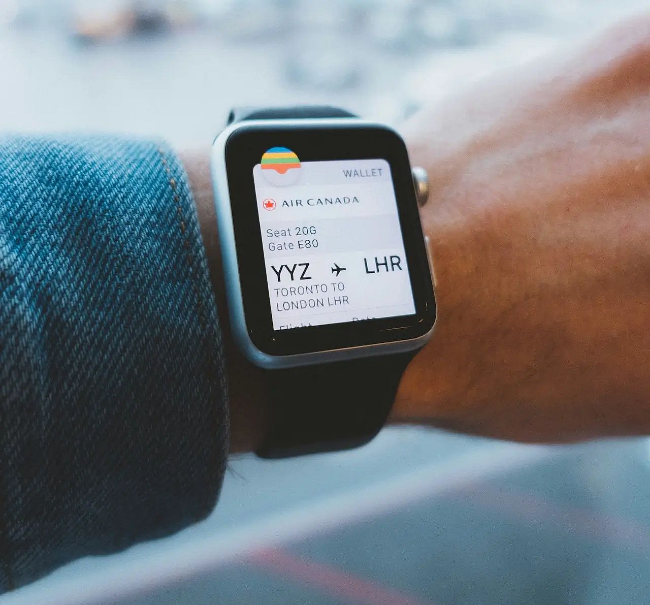 A watch showing an Air Canada flight from Toronto to London