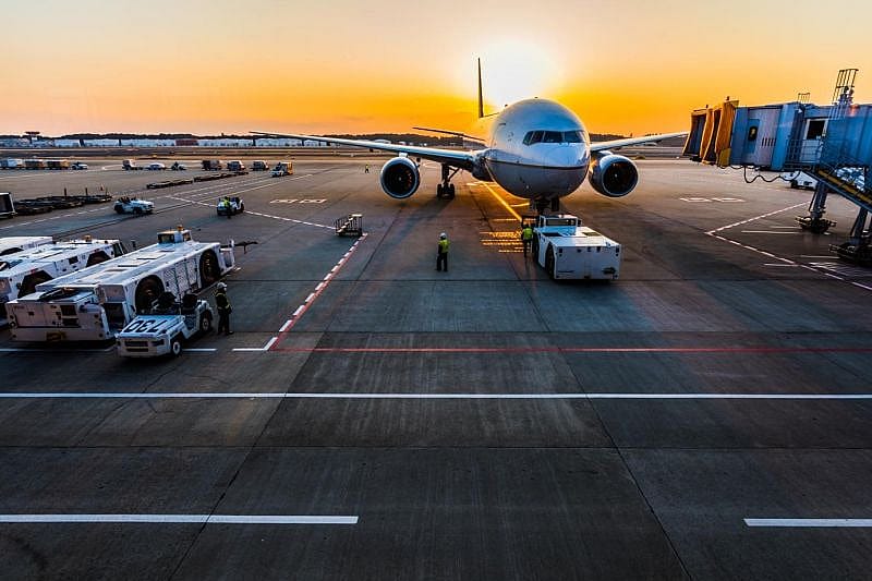 an airplane on the tarmac heading toward the airport gate