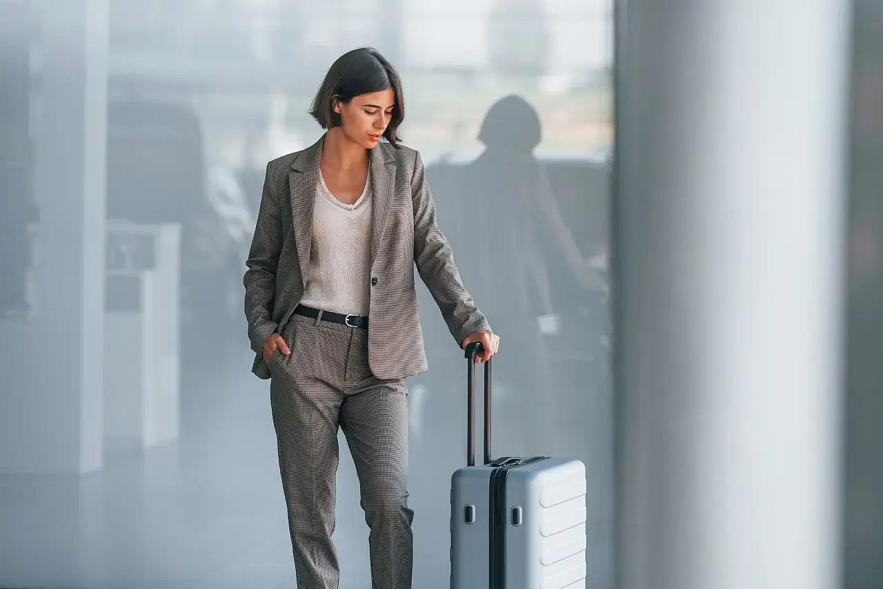 a woman with suitcase at the airport