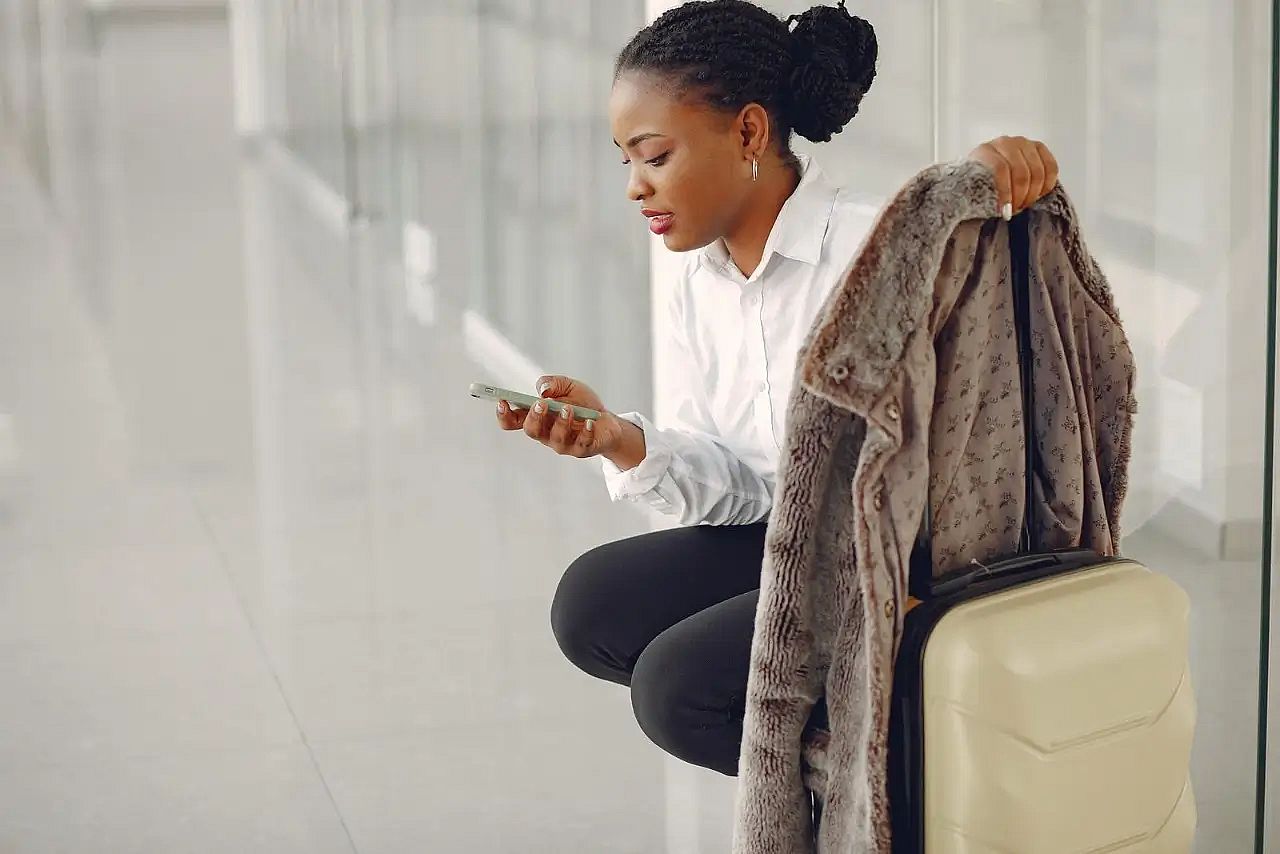 a woman with suitcase at the airport