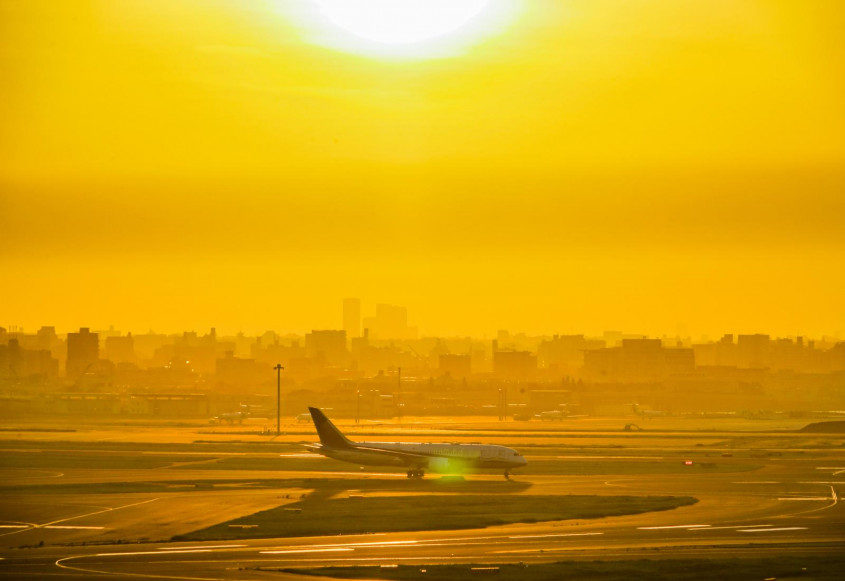 a landing plane on a beautifut sunset