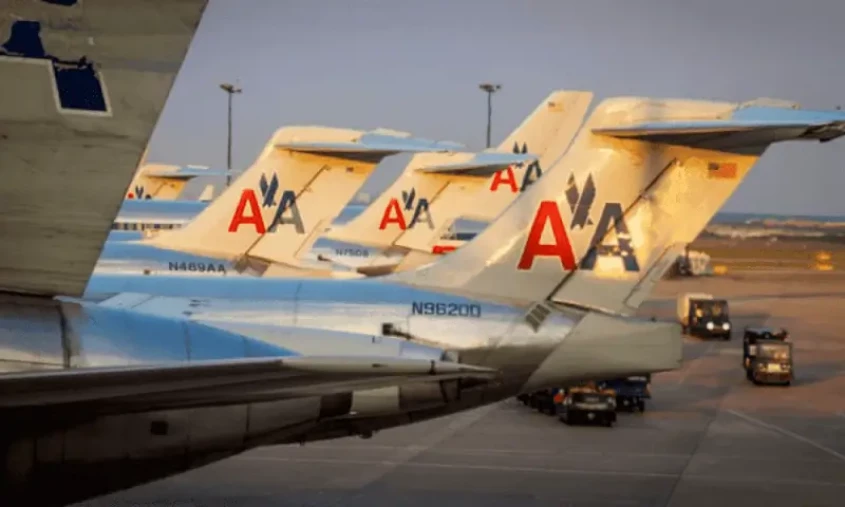 A delayed American Airlines plane parked with others