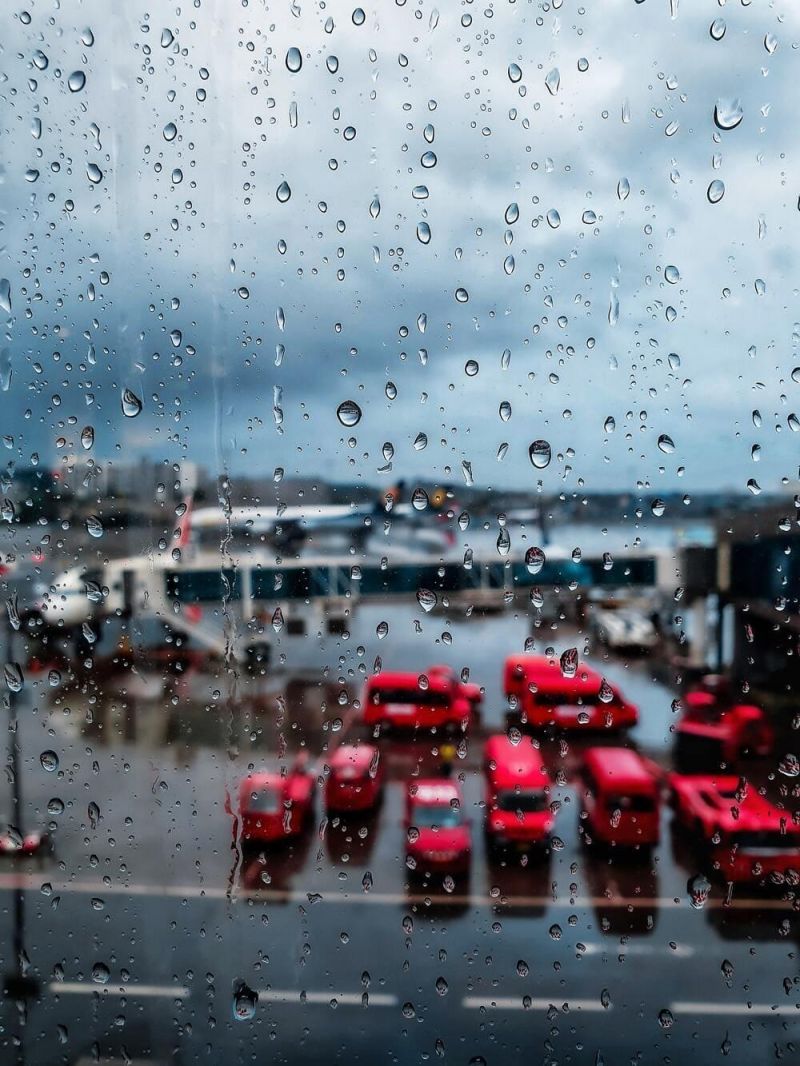 A delayed American Airlines plane on the tarmac on a rainy day