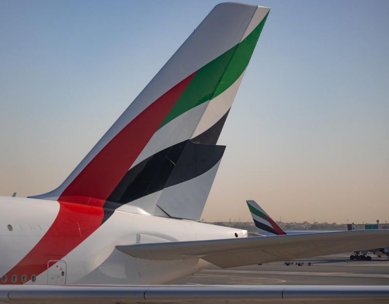 Emirates plane with Emirates logo on the tale