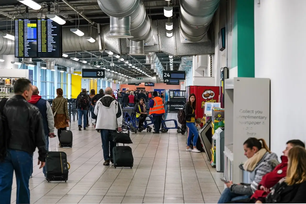 Passengers walking through Luton airport London