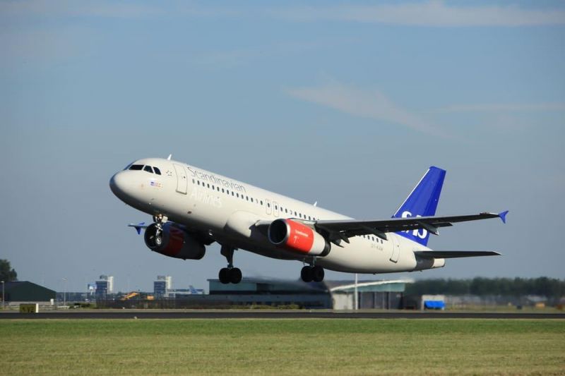 A delayed Scandinavian Airlines flight takes off from the airport