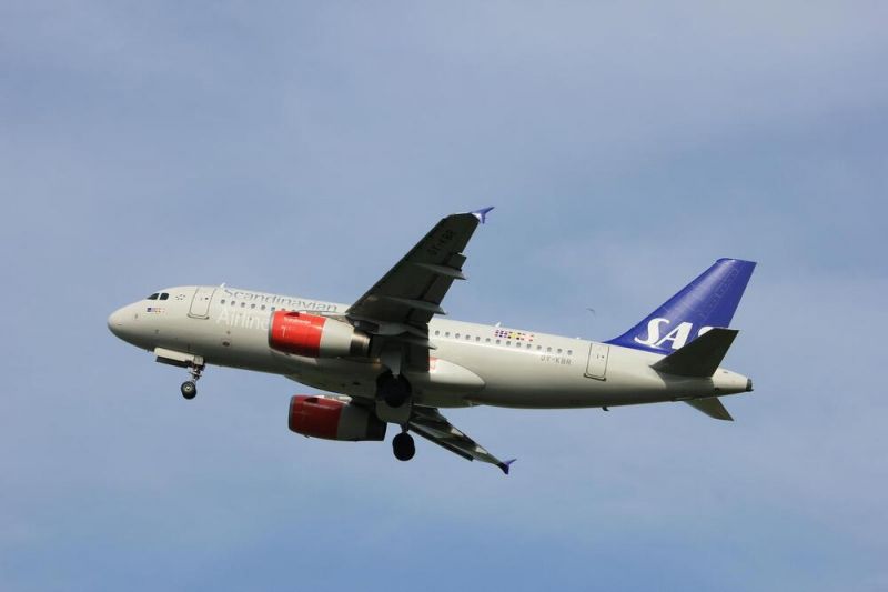 A delayed Scandinavian Airlines flight in mid-air above the airport