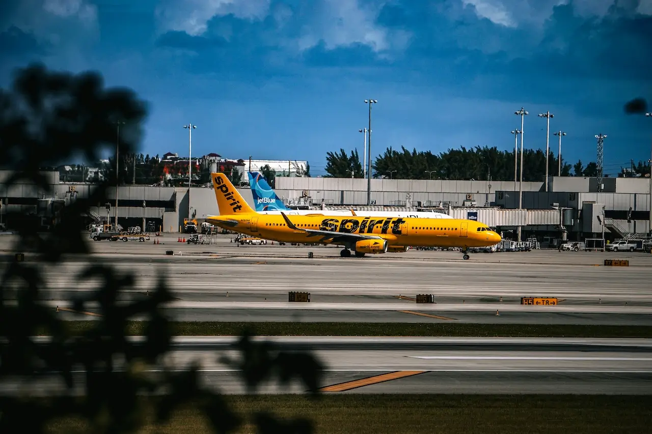 A bright yellow Spirit Airlines plane at the gate in Fort Lauderdale