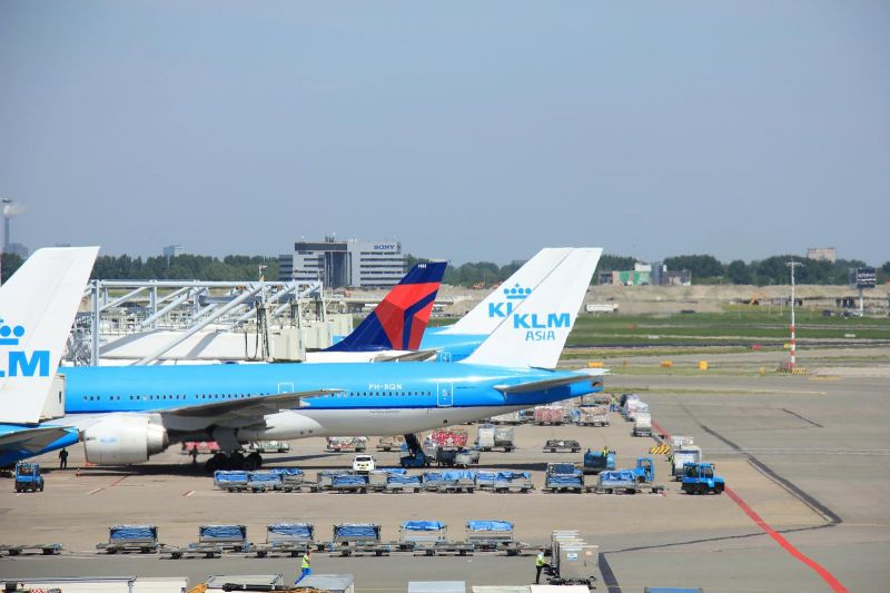 a KLM airplane at the gate