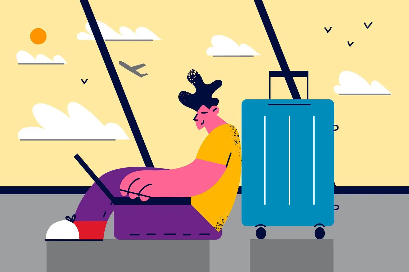 un homme qui travaille sur son ordinateur dans un aeroport