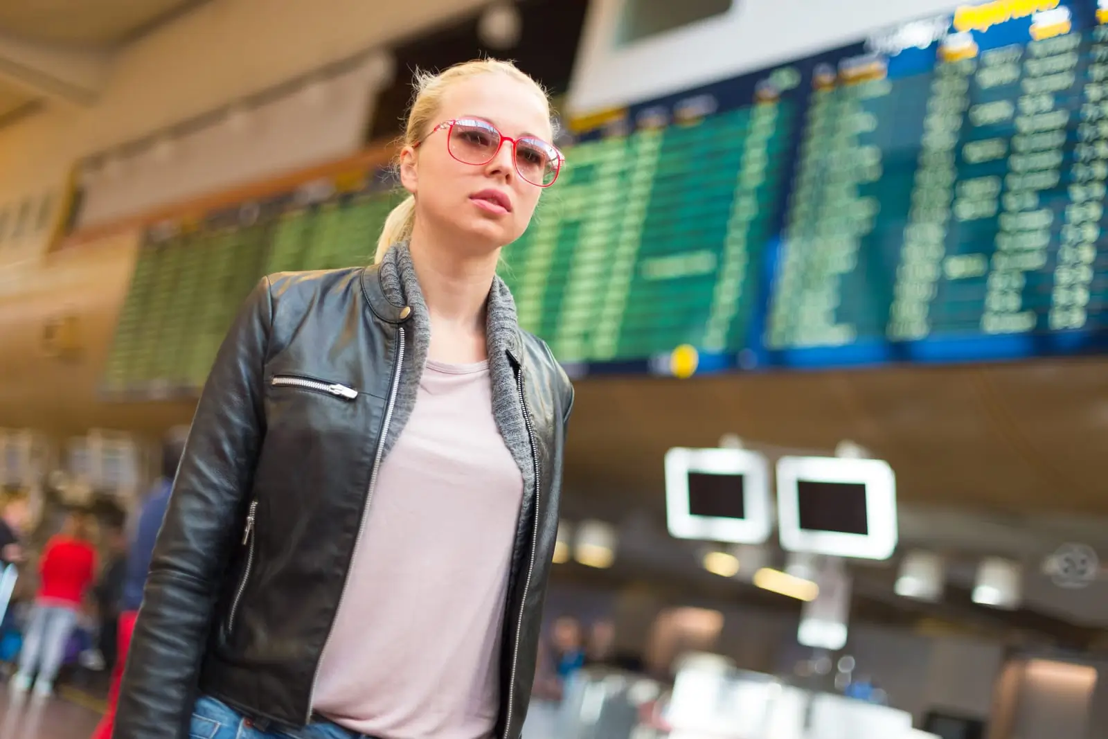 a traveller walking in airport terminal
