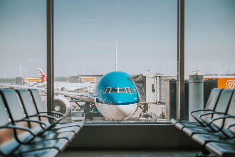 a view of the airplane from the airport lounge