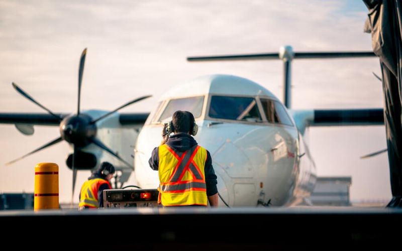 Crew members step off a delayed Eurowings flight