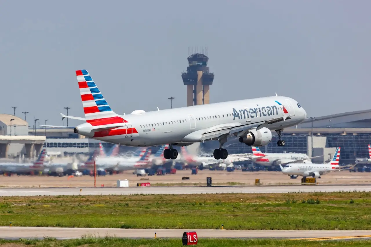 American Airlines taking off from a runway at Dallas Fort Worth Airport