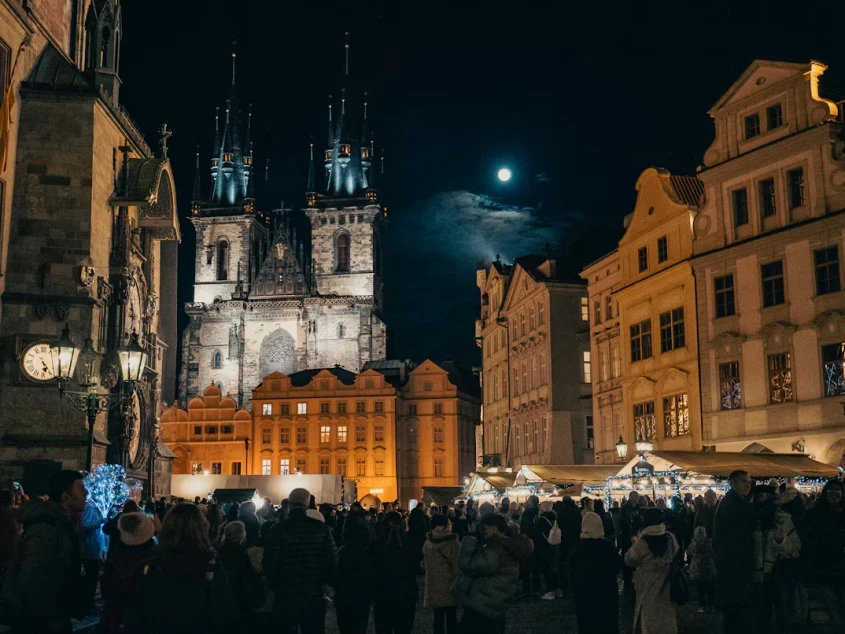 Prague Old Town Square Christmas market at night with the Church of Our Lady before T&yacute;n