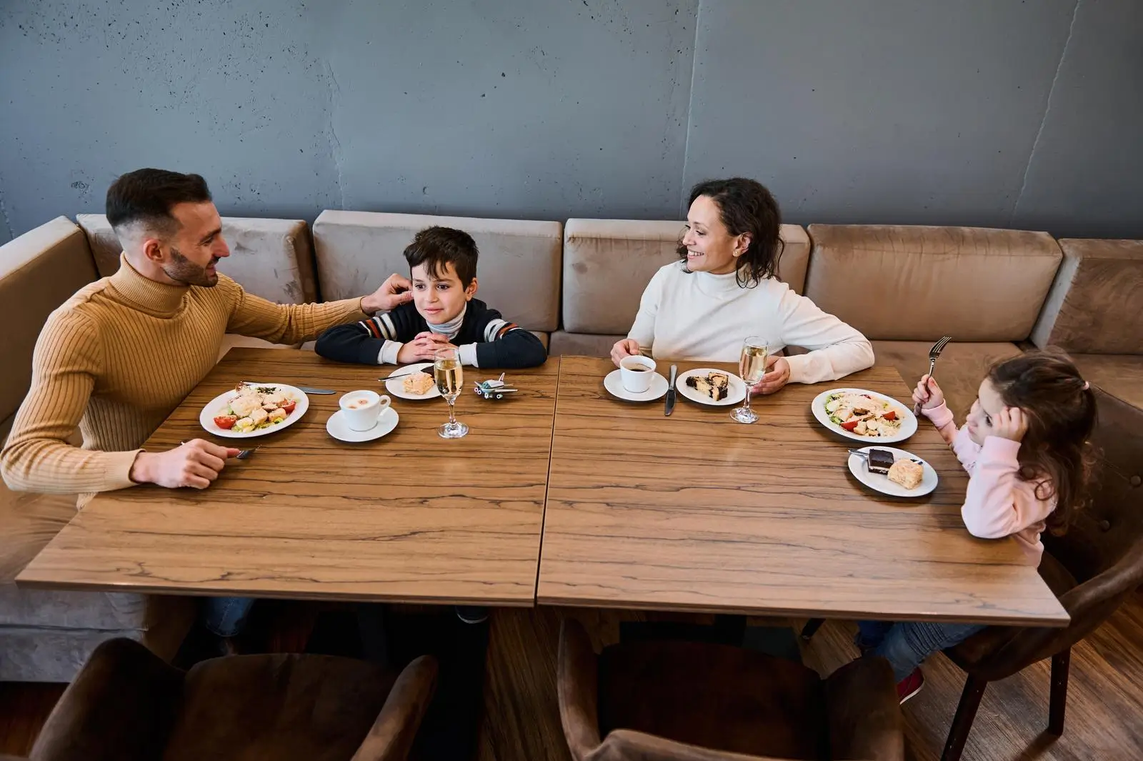 family having lunch together in an airport restaurant