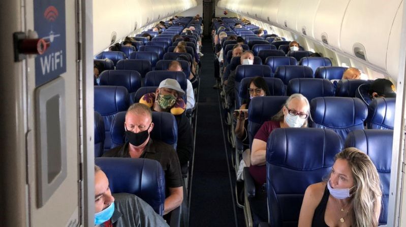 Passengers waiting to take off on board a delayed Wizz Air flight