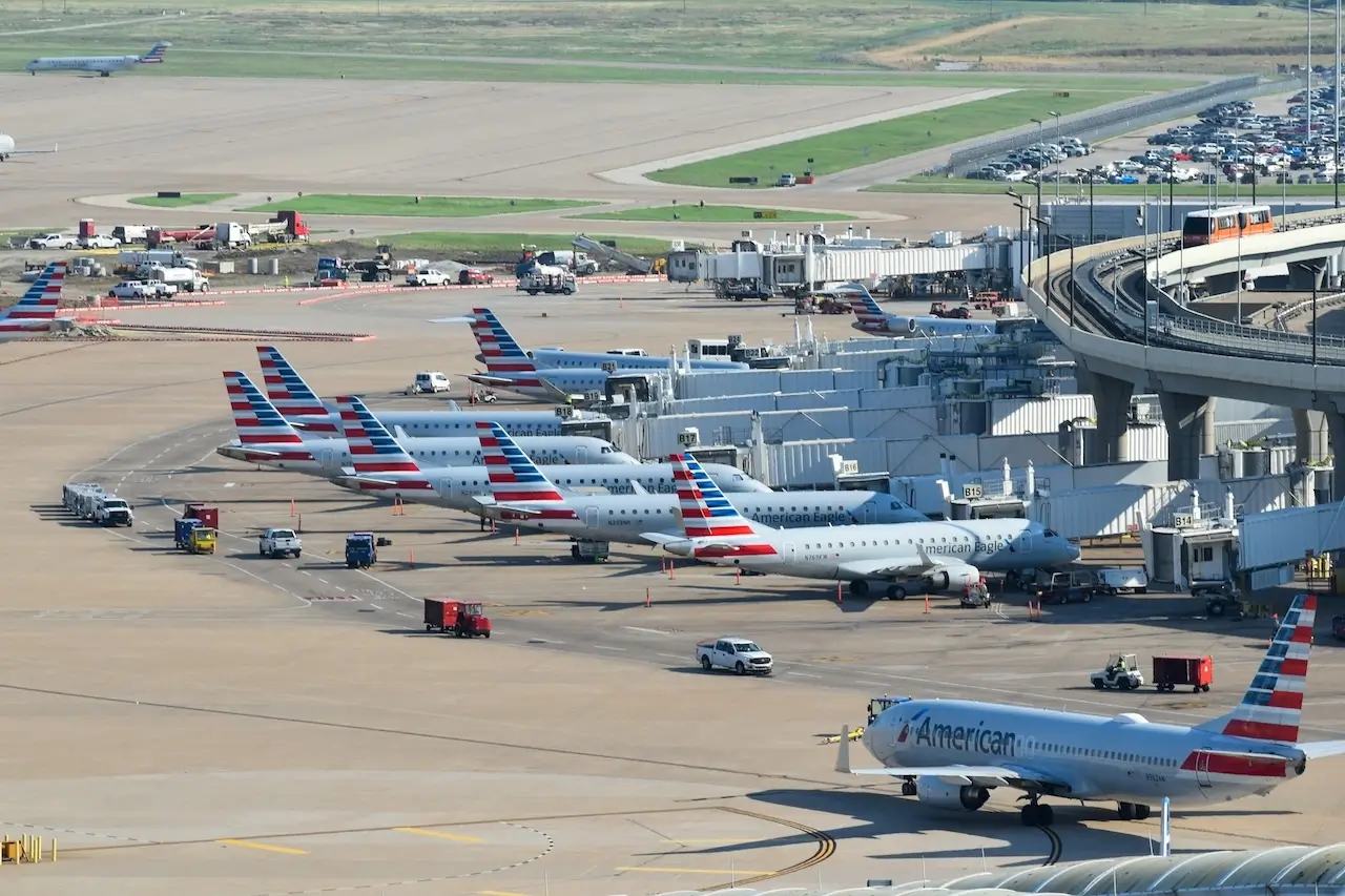 Multiple American Airlines planes part at the gates at Dallas-Fort Worth Airport.