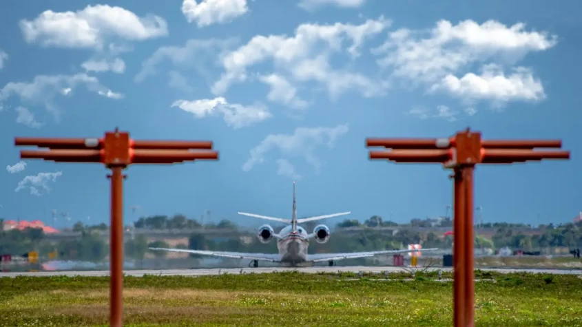 A plane waiting to take off on the runway at Palm Beach International Airport