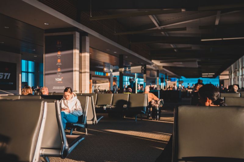 Passengers waiting in the airport after cancelled Vueling flight