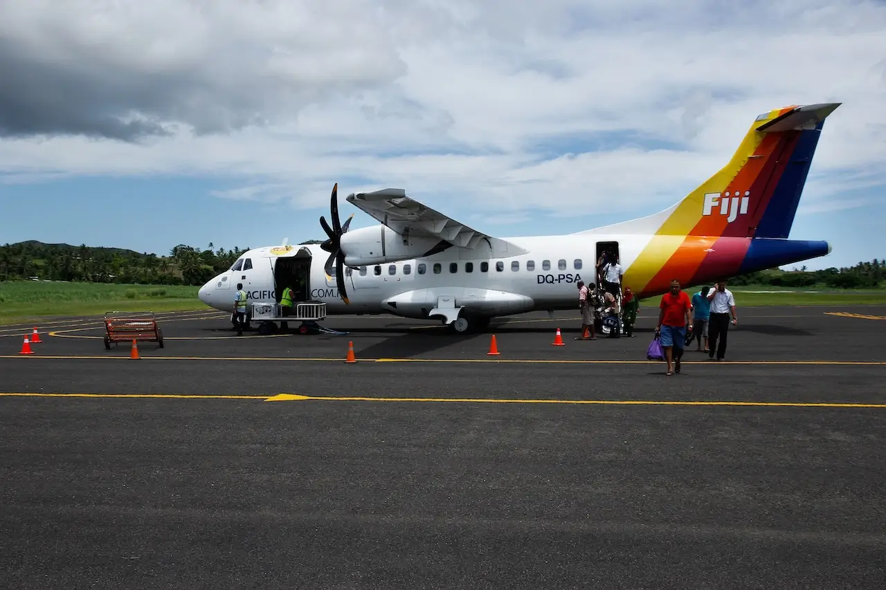 Passengers disembarking from a Fiji Airways delayed flight