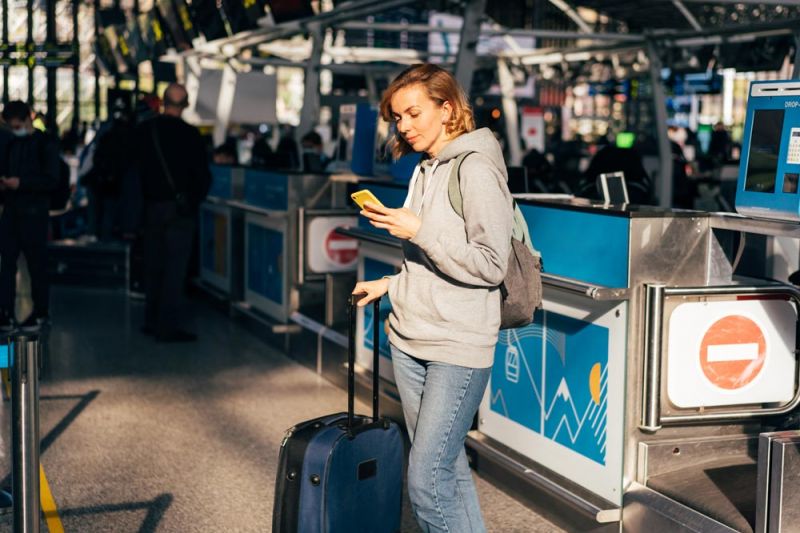 Passenger waiting for a new flight after a Eurowings flight cancellation