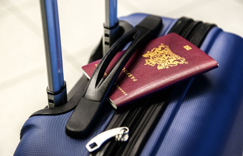 passport sitting on a suitcase
