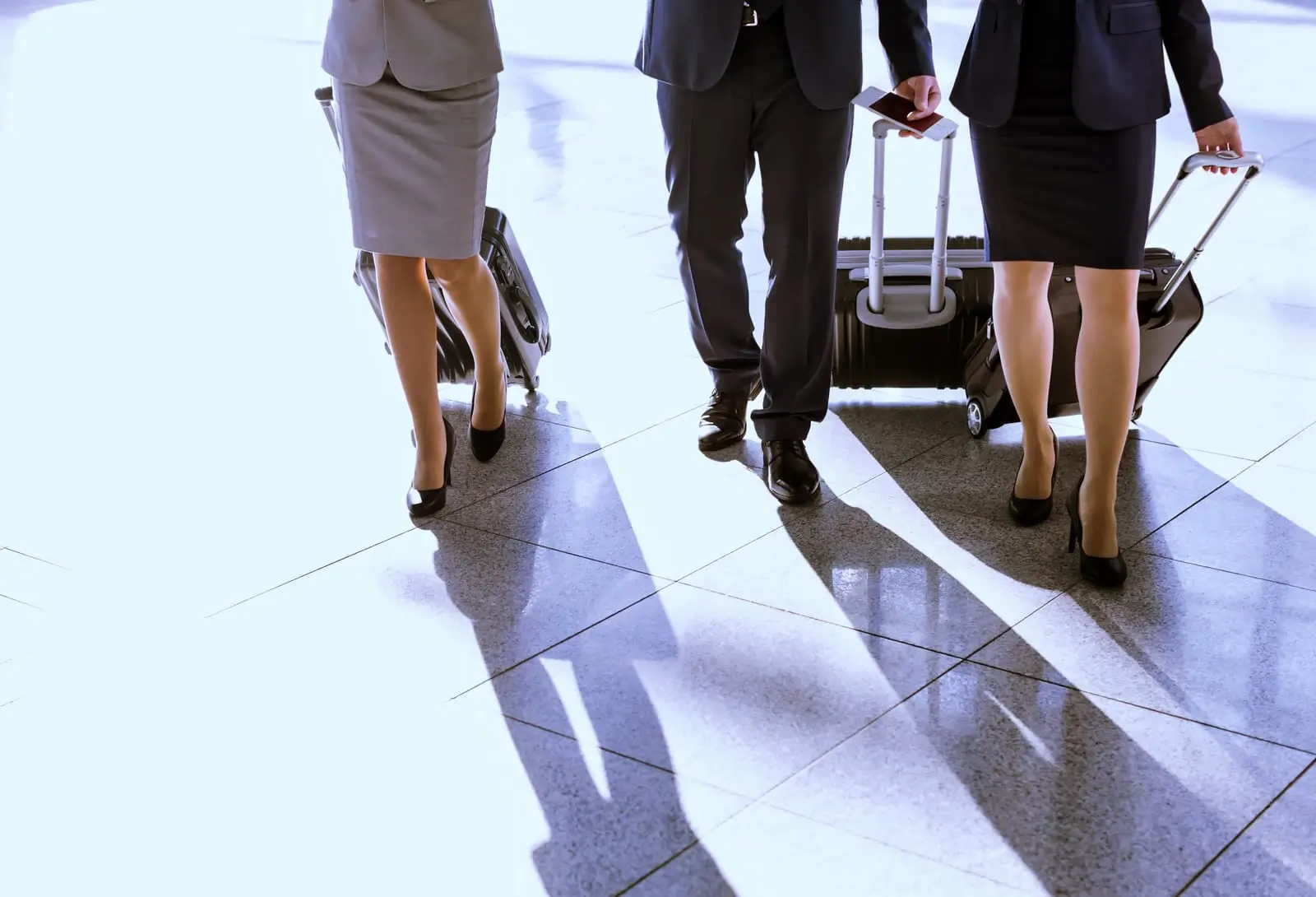 people walking with their suitcase in airport