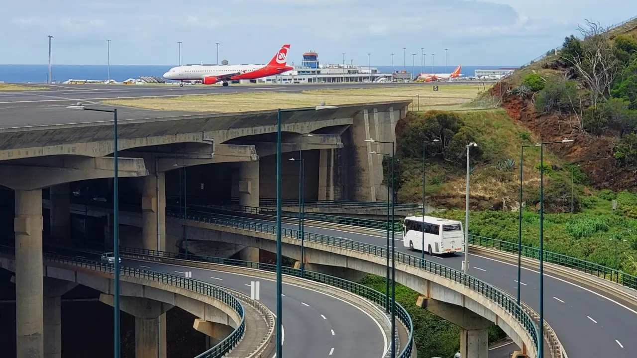 The road going under Madeira Airport with planes landing above