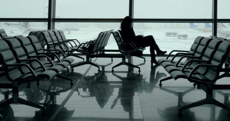 A passenger waits for a Transavia delayed flight