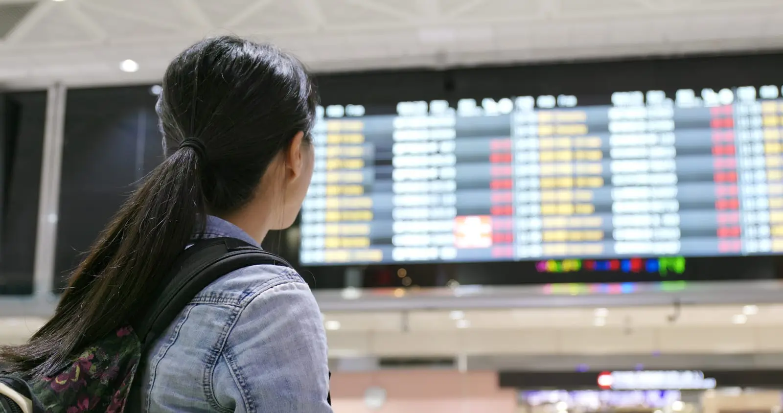 woman holding passport in the airport