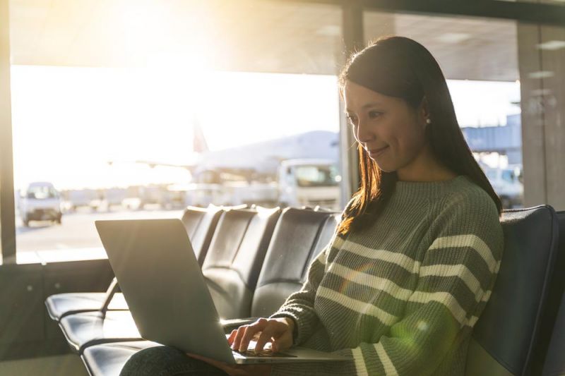 Woman looking for information about flight delays in Tenerife South Airport