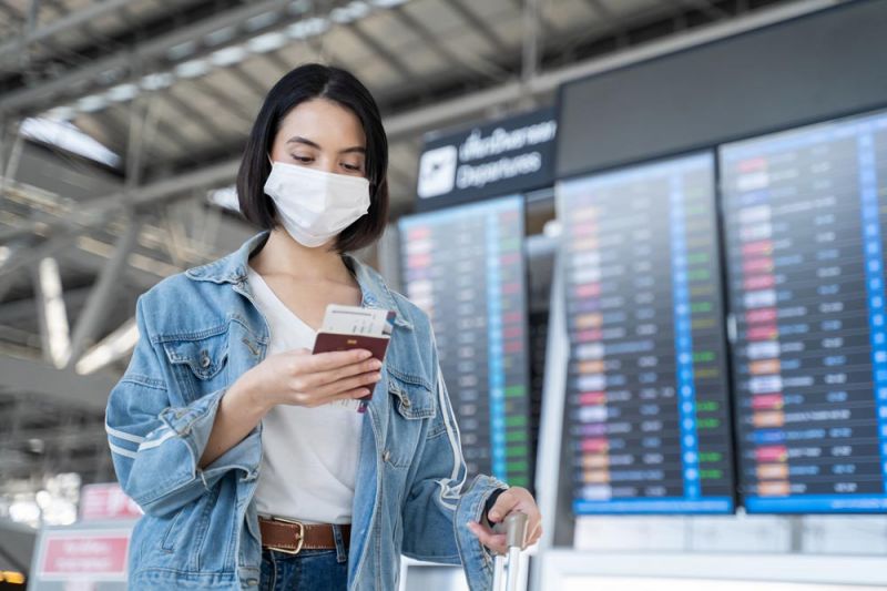 Woman looking if flights to Mallorca are canceled