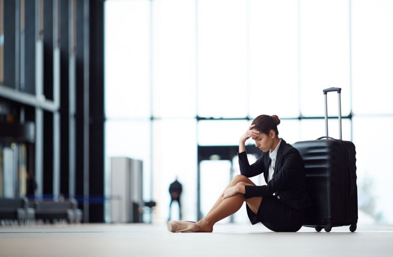 Woman sitting at the airport when Air France flight delayed