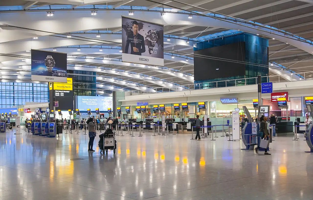 people walking through Heathrow Terminal 2