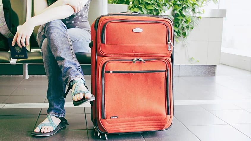 Passenger with Suitcase
