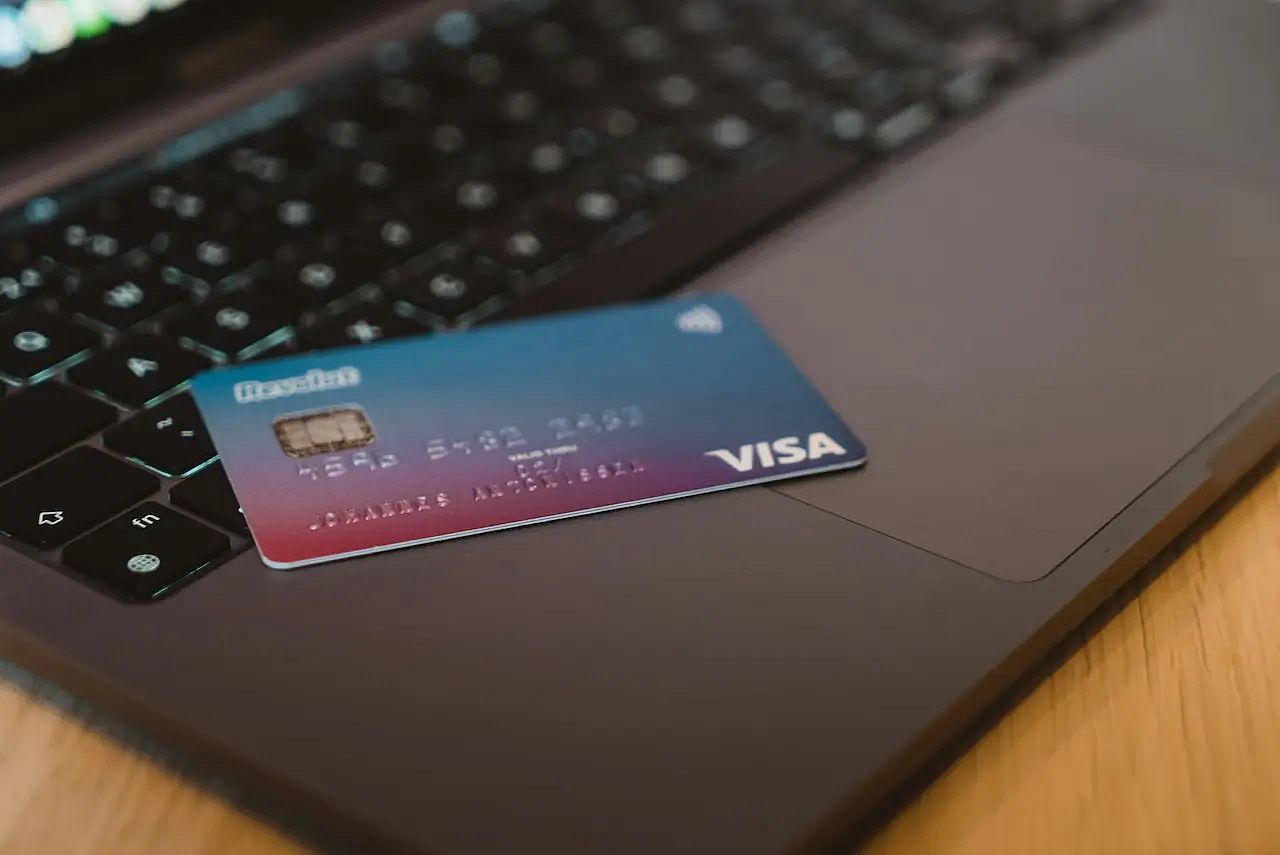 A credit card on a laptop to file an American Airlines chargeback to dispute