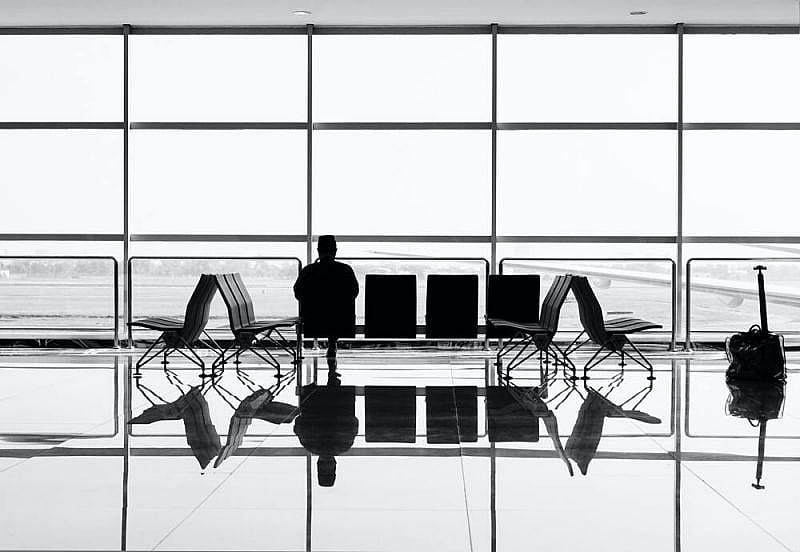 Passenger checking compensation near the gate after flight delayed