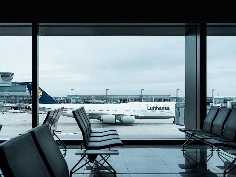 look via airport window on the plane of Lufthansa, the major carrier of Europe