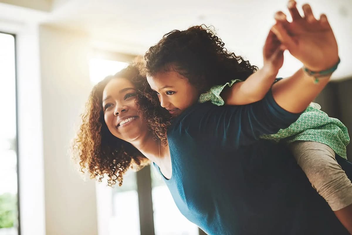 mother and child are playing flying