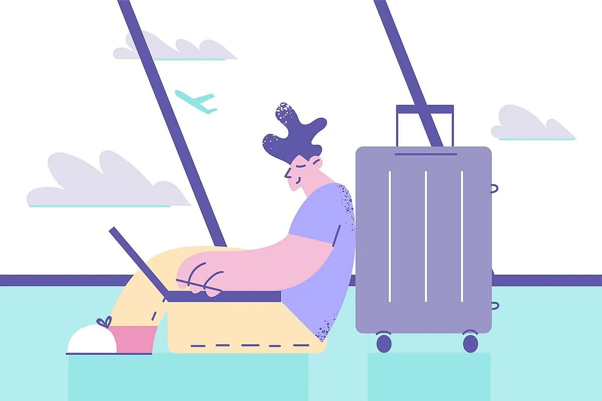 passager utilisant son ordinateur portable en attendant son avion